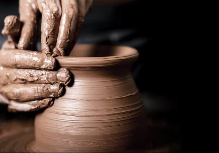 Hands of potter making clay pot Hands of potter making clay pot